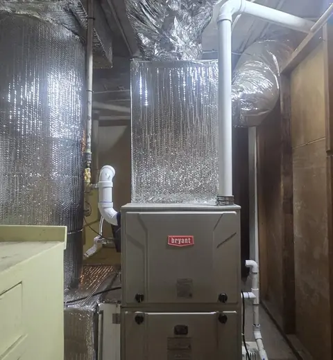 New Bryant gas furnace with an insulated supply plenum and PVC vent pipes